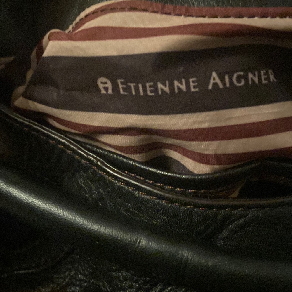 Etienne aligned purse zippered compartments on each side and back of purse